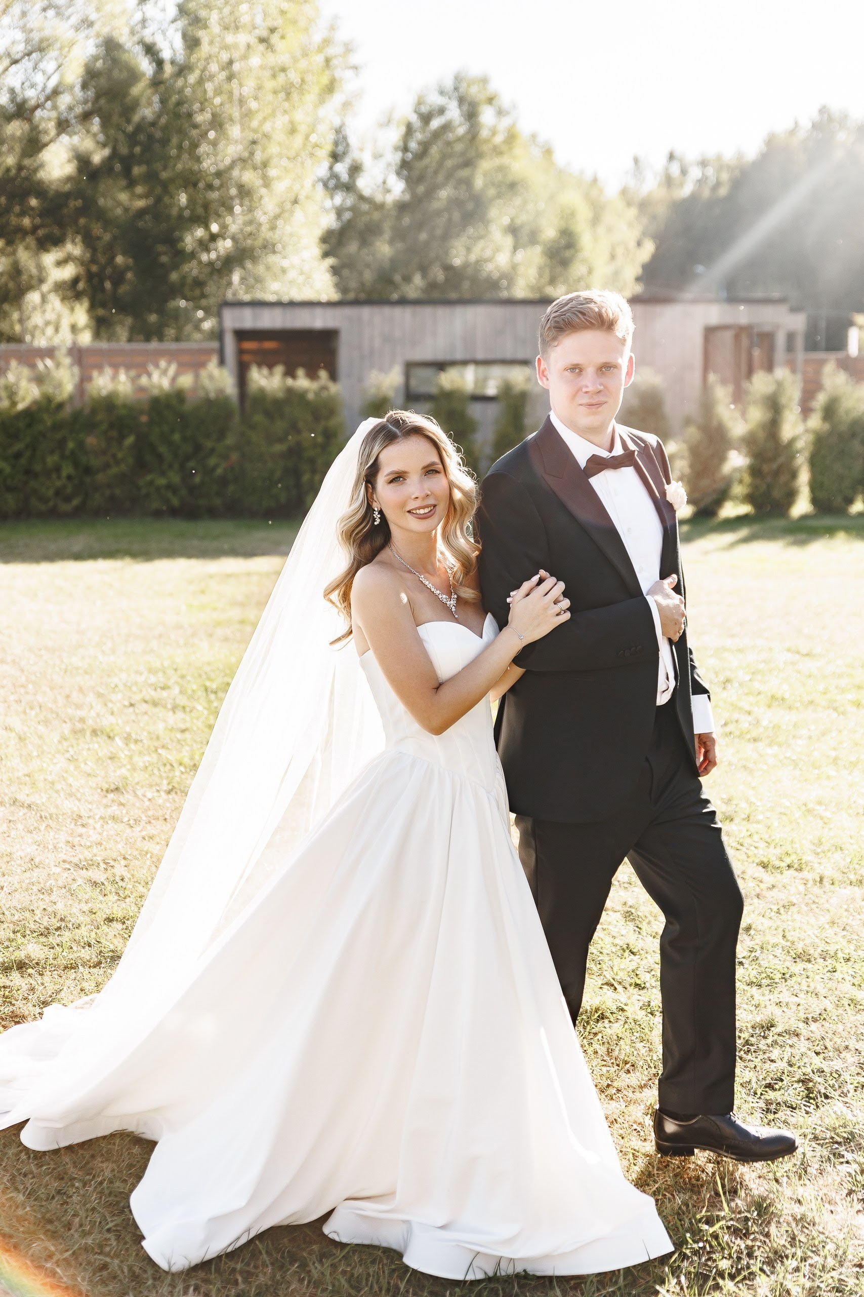 Bride and groom portrait in soft outdoor sunlight