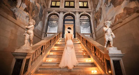 Grand staircase and frescoes at Ca’ Sagredo Hotel