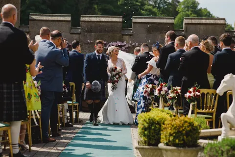 Outdoor wedding ceremony in the courtyard at Dundas Castle