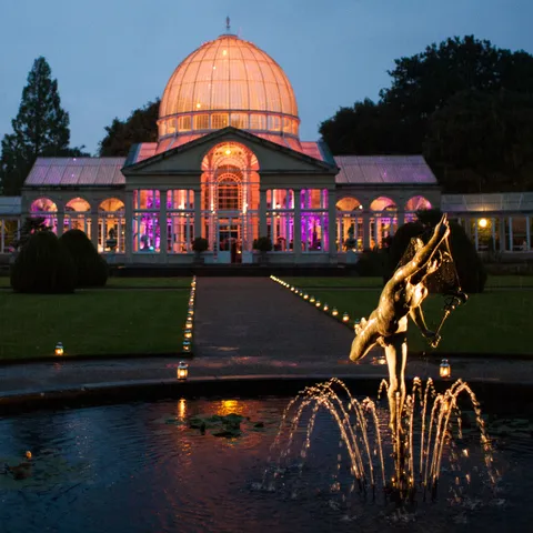 The Great Conservatory and fountain illuminated at Syon Park